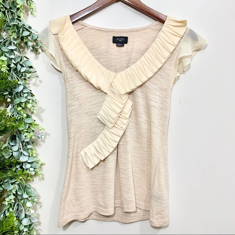 Deletta cream top with elaborate neckline